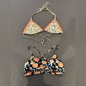 Two bikini tops, both floral pattern